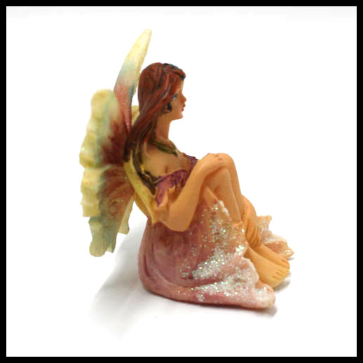 Fairy Sitting With Rainbow Wings