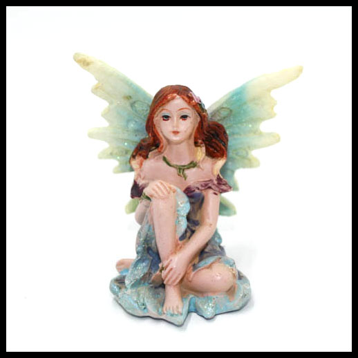 Fairy Sitting With Rainbow Wings