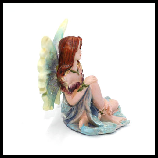 Fairy Sitting With Rainbow Wings