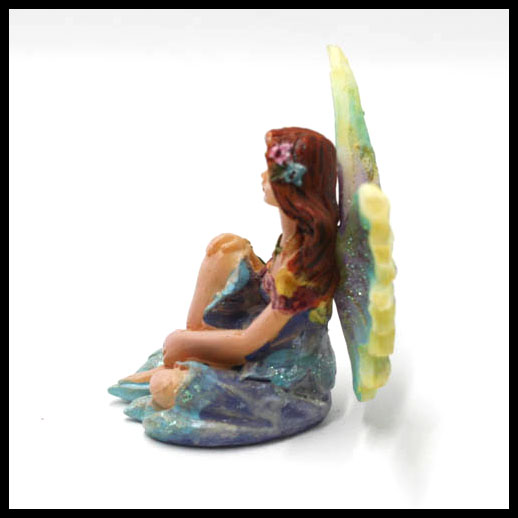 Fairy Sitting With Rainbow Wings