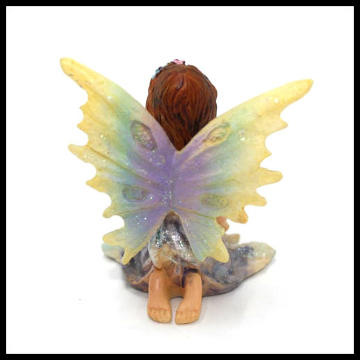 Fairy Sitting With Rainbow Wings