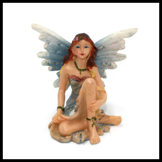 Fairy Sitting With Rainbow Wings