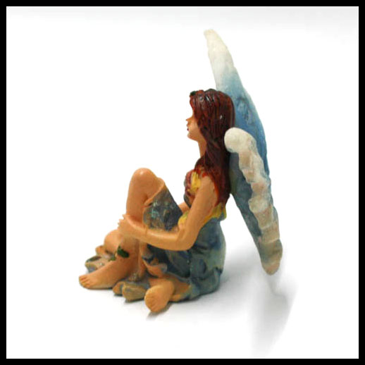 Fairy Sitting With Rainbow Wings